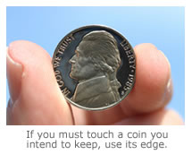 How to handle collectible coins if you must touch them 