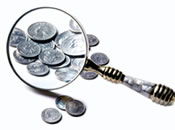 Magnifying Glass Over Coins