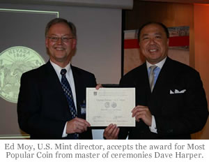 Ed Moy, U.S. Mint director, accepts the award for Most Popular Coin from master of ceremonies Dave Harper.