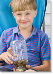 Child with jar of coins