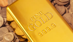 Gold bullion bar and US coins