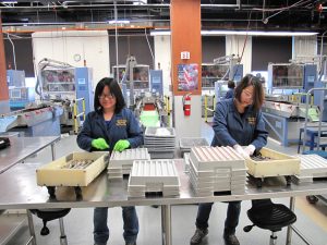 SF Mint Employees Racking Coin Blanks