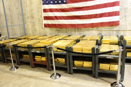 Gold Bars Stacked in Vault at West Point Mint, US Fag Above