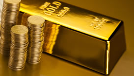 Gold bar and stack of gold coins