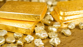 Four gold bars and nuggets