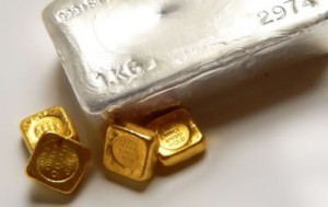 Silver bullion bar, four gold bullion bars