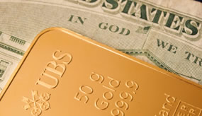 US Money and gold bar