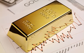 One gold bullion bar and graph