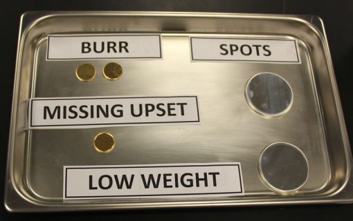 Examples of planchets with burrs, missing upset, spots and low weights