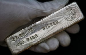 .999 fine silver bar held in hand