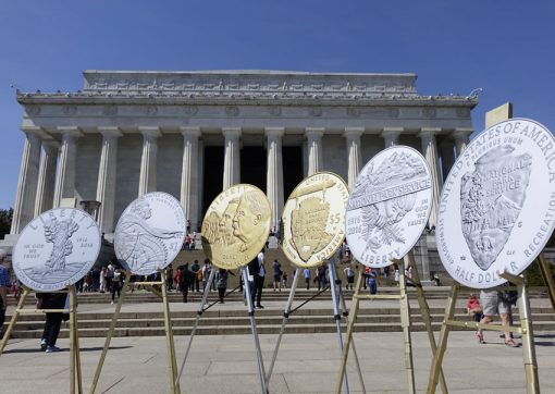Photo of large prints of the 100th Anniversary of the National Park Service Commemorative Coins