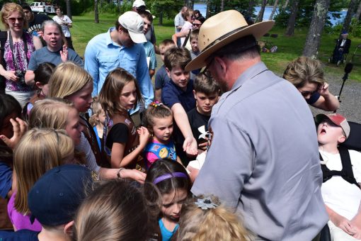 Children Receive Voyageurs quarter