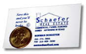 Veteran real estate broker Norman Schaefer’s eye-catching business card with a shiny dollar coin attached to it reads, “Save this and you’ll never be broke.”