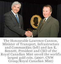 The Honourable Lawrence Cannon, Minister of Transport, Infrastructure and Communities and Minister responsible for the Royal Canadian Mint (left) and Ian E. Bennett, President and CEO of the Royal Canadian Mint unveil the world's first 100-kg, 99999 pure gold bullion coin with a $1 million face value. (2007. CNW Group/Royal Canadian Mint)