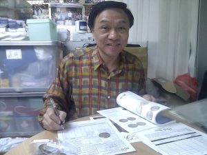 Ma Tak Wo submitting coins to PCGS