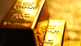 Gold Adds 0.7%, US Mint Gold Sales Highest Since Dec. 2009 Stacked bullion