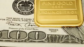 Gold, Silver Log First Weekly Loss in Three, US Bullion Coins Mixed $100 Bills and Gold Bar