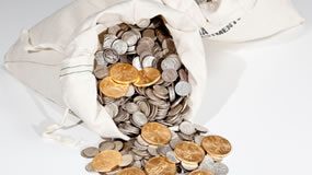 Gold Jumps Most in Year, Silver Soars 5.4%; US Bullion Coins Rally Bag of gold and silver coins