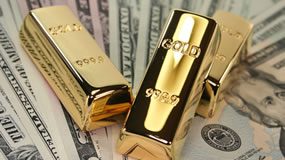 Gold, Silver Up for 3rd Day; Gains Extended After Fed Minutes Three gold bars on US bills