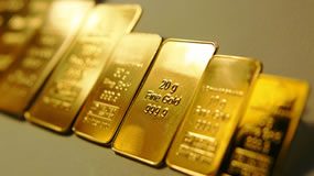 Gold Edges Up Week, Silver Surges; US Mint Bullion Coins Mixed Gold bars, seven side-by-side