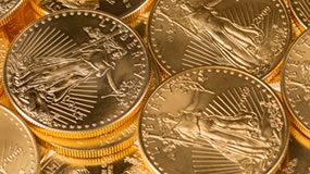 Gold, Silver Notch Weekly Gains; US Mint Bullion Coins Soar Pile of Gold Eagle Bullion Coins
