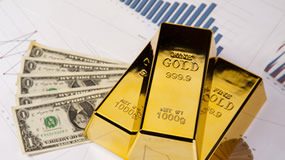 Gold, Silver and Other Metals Advance after Senate Deal Three gold bars, five $1s and graphs
