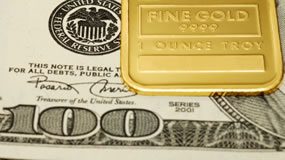 Gold, Silver Decline as Dollar Rises, US Gold Coins Gain $100 and gold bar