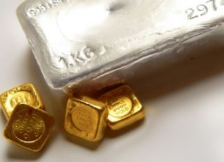 Gold and Silver Rise Ahead of Fed Meeting, Up for Second Session Silver bullion bar, four gold bullion bars