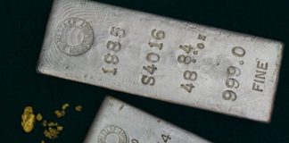 Gold Rallies 2.3%, Silver Jumps 3.1% Two silver bullion bars and gold nuggets