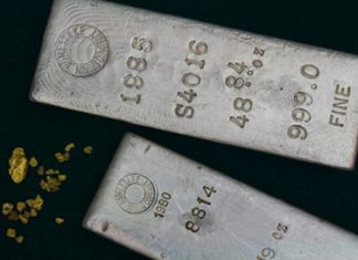 Gold Rallies 2.3%, Silver Jumps 3.1% Two silver bullion bars and gold nuggets