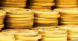 Gold Soars 4.4% on Week, Silver Rallies 7.5%; US Mint Coins Up Stacks of gold coins