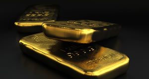 Gold Remains at 6-Month High; 1/10 oz Gold Eagles Rise Three Gold Bullion Bars, Dark Background