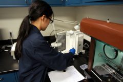 Grace Cheong, Chemist at West Point MInt, weighing 0.9999 fine gold