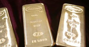 Gold and Silver Prices Rebound on Safe-Haven Demand Three silver bullion bars