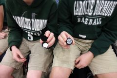 Children hold their new Kisatchie National Forest quarter