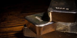 Gold Dips from 2-Week High, Silver Prices Ease Silver bars closeup