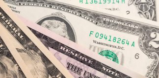 US Banknote Production Reaches 579.2 Million in March 2017 Different american dollars banknotes close-up. Background texture