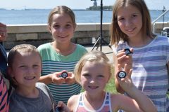 Kids with Ellis Island quarters