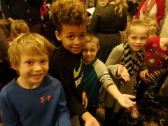 Children hold free Pictured Rocks National Lakeshore quarter