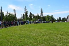 Line of people waits to exchange cash for quarter rolls