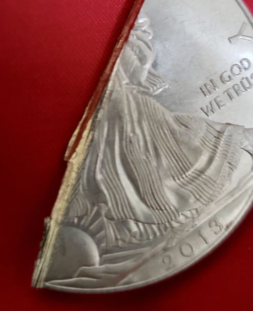 Base metal center of fake silver American Eagle