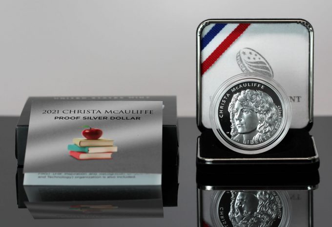 This CoinNews photo shows a 2021-P Proof Christa McAuliffe Silver Dollar and its packaging