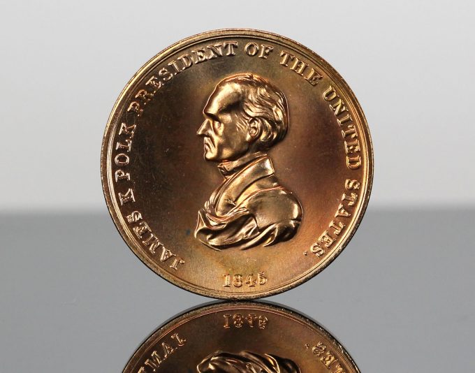 The US Mint also strikes Presidential bronze medals.  This CoinNews photo shows the obverse of a James K. Polk Bronze Medal.  This is the same design as on the obverse of the James K. Polk Presidential Silver Medal.