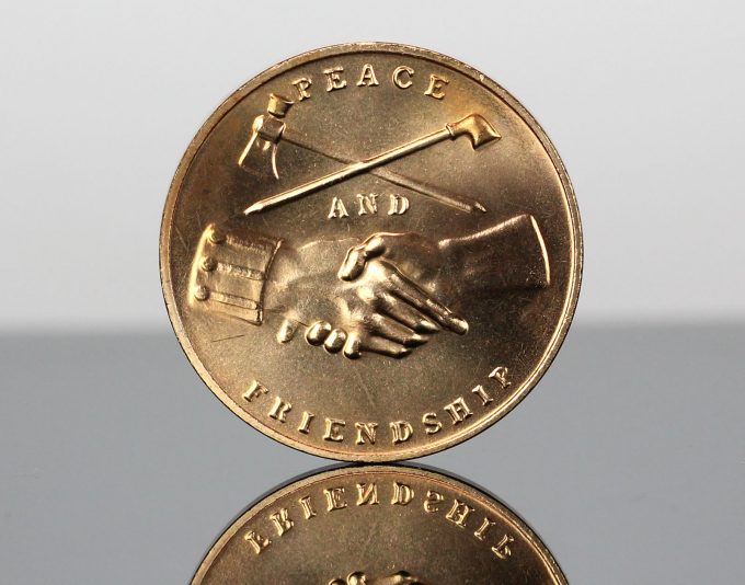 This photo is of the same bronze medal but with its reverse shown. The design also appears on the new silver medal’s reverse.
