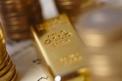 Fine gold 9999 close up and gold coins May 12, 2023