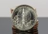 US Mint Sales: Alabama Innovation $1 Rockets to Strong Debut CoinNews photo stack of American Innovation Dollars for Alabama