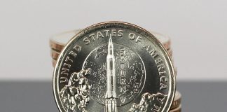 US Mint Sales: Alabama Innovation $1 Rockets to Strong Debut CoinNews photo stack of American Innovation Dollars for Alabama