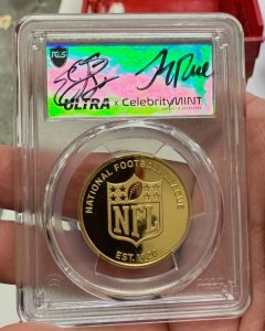 Emmitt Smith and Jerry Rice autographed the insert for this gold NFL round