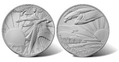 Pair of silver commemorative coins: a standing goddess releasing doves at sunrise, with LIBERTY inscription on the left coin and UNITED STATES OF AMERICA on the right.