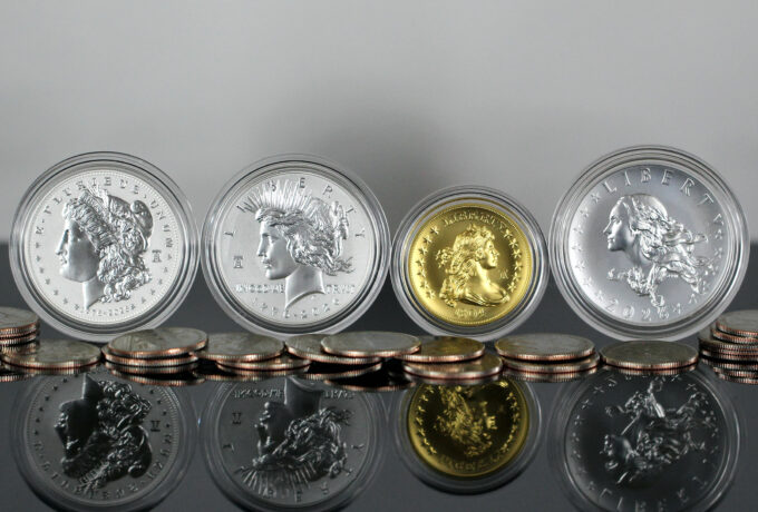 CoinNews photo showing 1776-2026 Morgan and Peace Silver Dollars, Constitution Quarters, and 1804 Gold Coin and Silver Medal